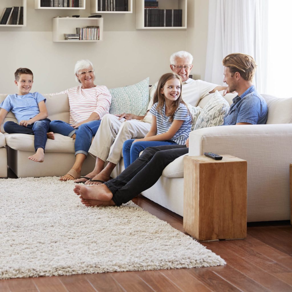 Family gosping in living room in Greenville, SC | Lake Forest Flooring